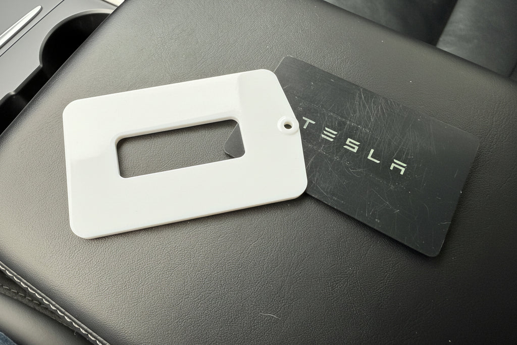 Tesla key card on a center arm rest