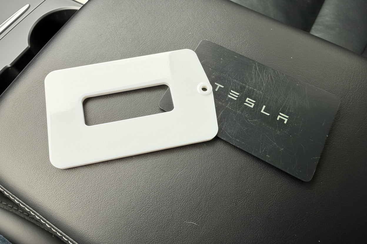 Tesla key card on a center arm rest